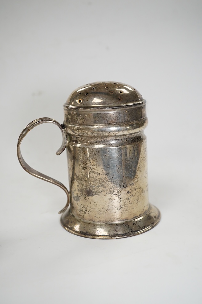 A late Victorian silver Guernsey milk can, marks rubbed, 14cm, a small silver mug and a Scottish silver kitchen pepper, Hamilton & Inches, Edinburgh, 1898, gross weight 16.4 oz. Condition - poor to fair